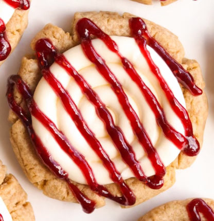 Cheesecake Cookie w/strawberry drizzle.